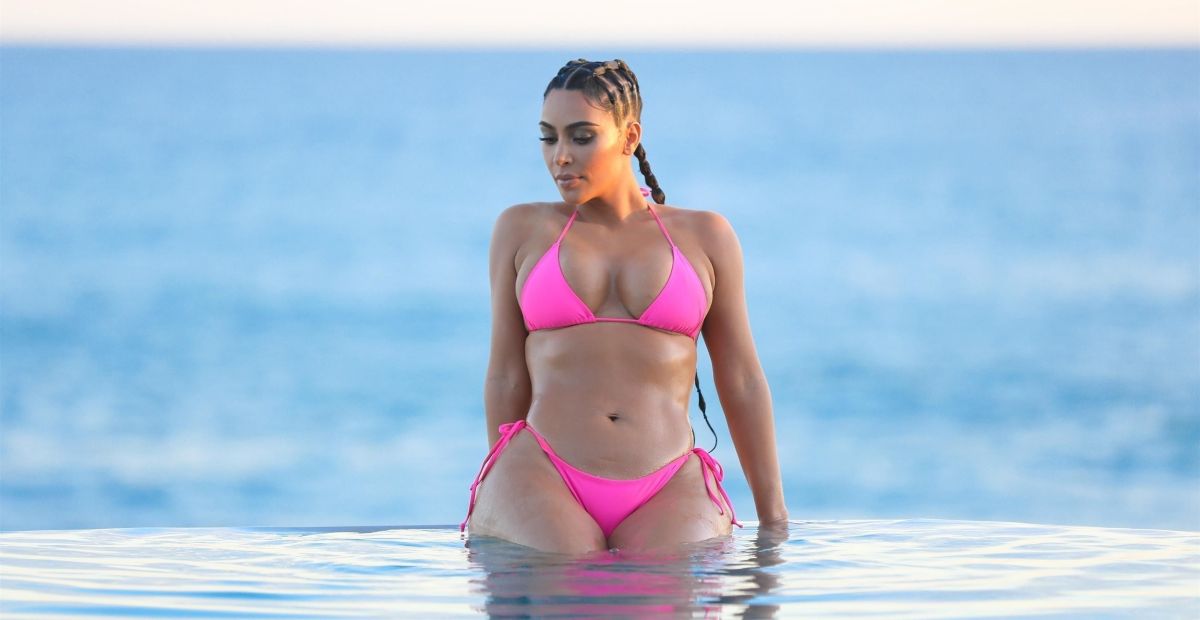 kim-kardashian-boasts-tremendous-curves-with-a-white-minibikini-from-the-beach