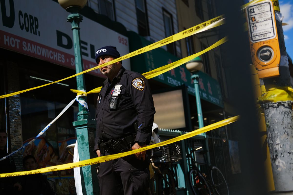 bystanders-seek-shelter-after-a-gunman-opened-fire-in-manhattan,-injuring-two